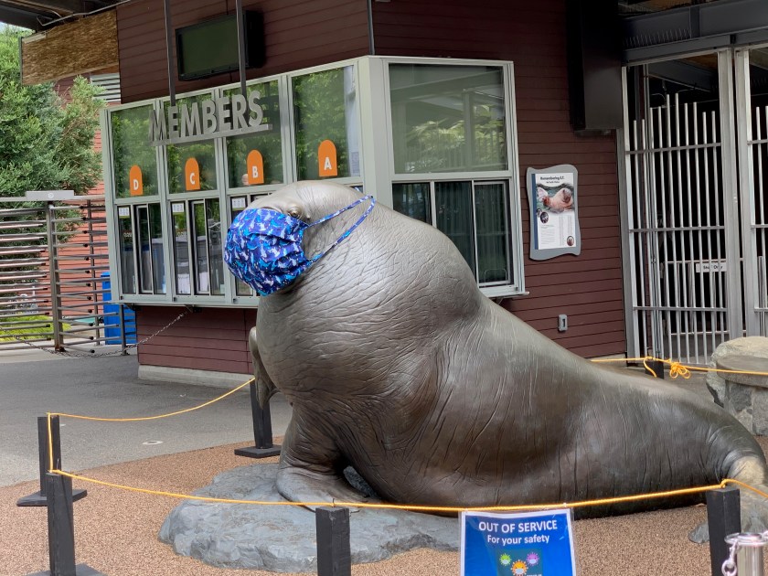walrus statue wearing mast at zoo entrance